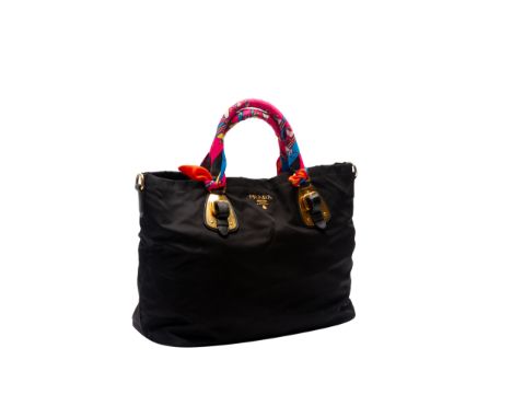 A PRADA BLACK TESSUTO NYLON AND LEATHER HANDBAG With gold tone hardware, handles each wrapped in an Hermes Twilly scarf, with