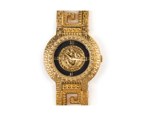 A GIANNI VERSACE SIGNATURE GOLD PLATED BRACELET WATCH The circular dial with Roman numerals on black chapter ring and central