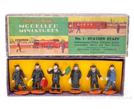 Hornby O Gauge Modelled Miniatures No.1 Station Staff.  Contents are Excellent restrung to a backing board in a Good Plus pic