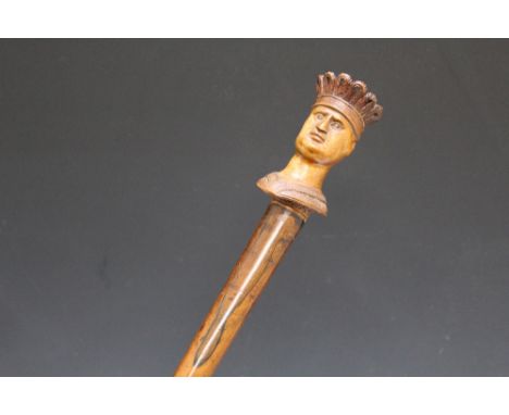 AN UNUSUAL CARVED WALKING STICK IN THE FORM OF A TOBACCONIST TYPE FIGURE, L 92 cm