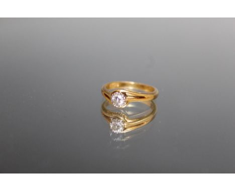 AN 18 CARAT YELLOW GOLD BRILLIANT CUT DIAMOND SOLITAIRE RING,  the diamond being of an estimated 0.16 carat, ring size J