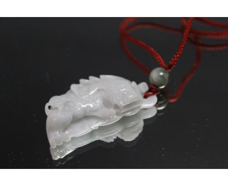 A JADE PENDANT IN THE FORM OF A DRAGON, W 5.5 cm