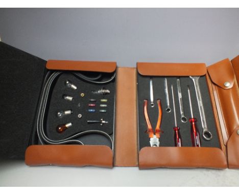 AN ORIGINAL VINTAGE FERRARI 550 MARANELLO TOOL KIT, all contents present apart from the towing hook