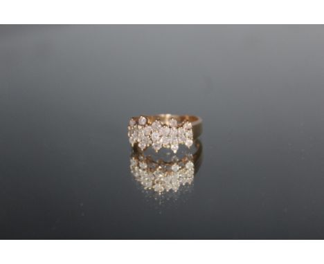 A DIAMOND CLUSTER RING, set with twenty five brilliant cut diamonds, ring size R 1/2