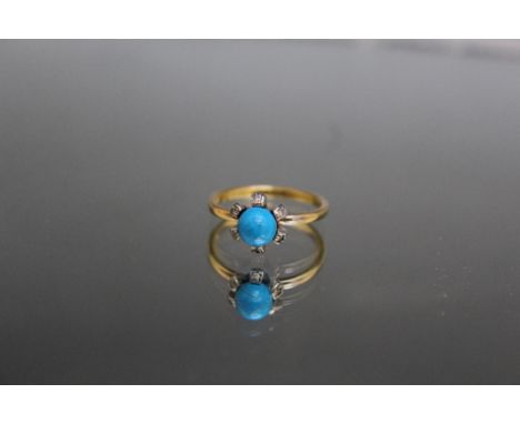 AN 18 CARAT YELLOW GOLD DYED HOWLITE AND DIAMOND RING, the Howlite being an estimated 6mm round, ring size N 1/2
