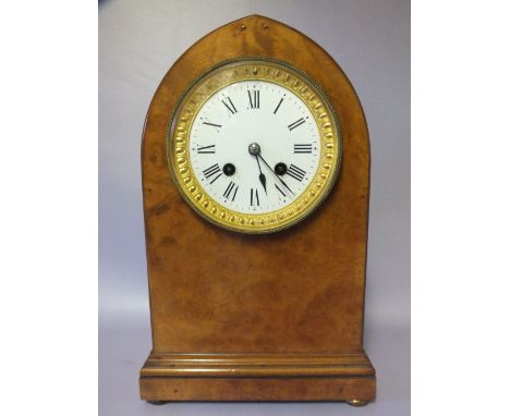 A BURR WALNUT ARCHED MANTLE CLOCK WITH JAPY FRERES MOVEMENT, striking on a bell, stamped to the movement, finely figured case