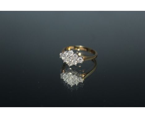 A HALLMARKED 18 CARAT GOLD ONE CARAT DIAMOND CLUSTER RING, set with nine brilliant cut diamonds. ring size Q