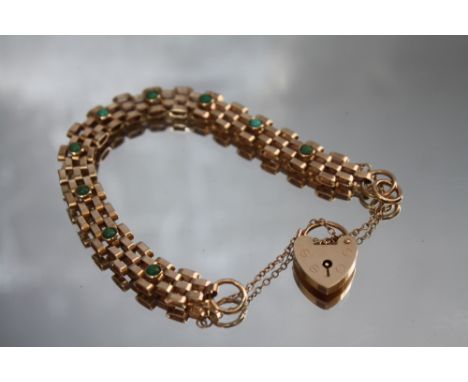 AN UNUSUAL 9CT GOLD TURQUOISE SET THREE BAR GATE BRACELET, with heart shaped clasp and safety chair, approx weight 13.5 g