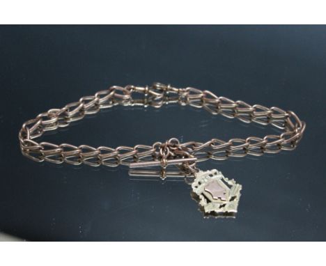 A HALLMARKED 9 CARAT GOLD CHAIN, together with a hallmarked 9 carat two colour gold fob, approx combined weight 47.5 g