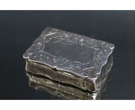 A HALLMARKED SILVER SNUFF BOX - BIRMINGHAM 1859, the cartouche on the underside is engraved with a village church scene, make