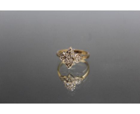A 9 CARAT GOLD YELLOW GOLD DIAMOND CLUSTER RING, the brilliant cut diamonds being of an estimated 0.33 carat, ring size L