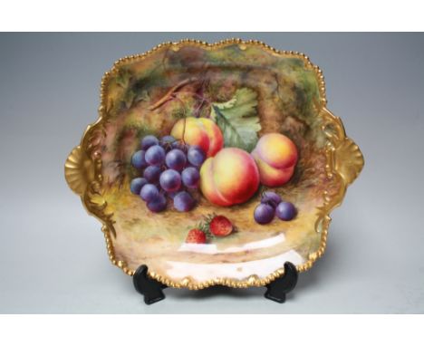 A ROYAL WORCESTER TWIN HANDLED  DISH BY T. LOCKYER, decorated with fruit to a mossy background, gilt embellishment to frilled