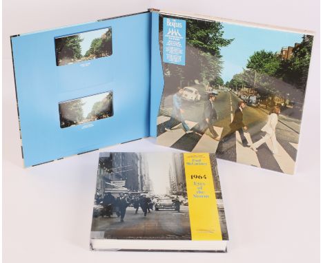 The Beatles - Abbey Road Anniversary CD Boxset And 1964: Eye Of The Storm book. Housed in a sturdy LP-sized full-color cardbo