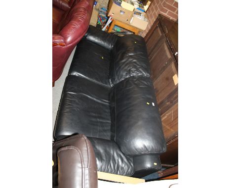 A BLACK LEATHER THREE SEATER SOFA