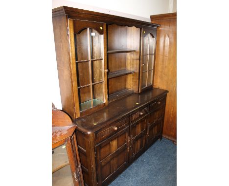 AN ERCOL STYLE DARK OAK GLAZED DRESSER