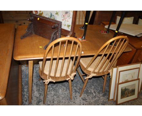 AN ERCOL ELM & BEECH DRAWLEAF TABLE & FOUR HOOP BACK CHAIRS
