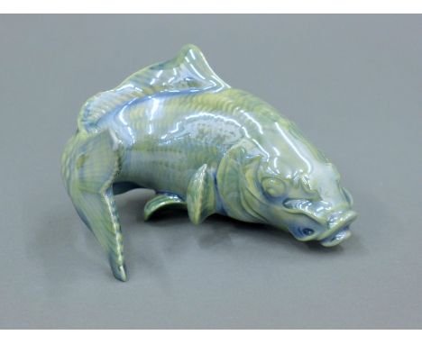 A Royal Worcester lustre glazed porcelain model of a fish. 9.5 cm long.