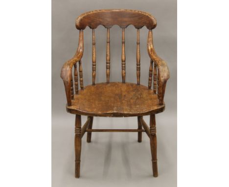 A Victorian turned stick back chair with bentwood arms. 56 cm wide.