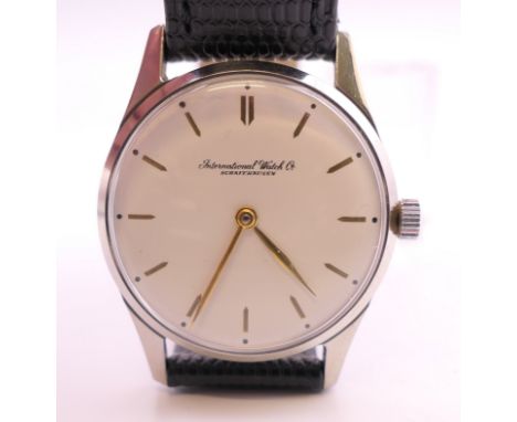 An IWC (International Watch Co) stainless steel mechanical wristwatch, circa 1960s, white dial with gilt arrowhead baton hour