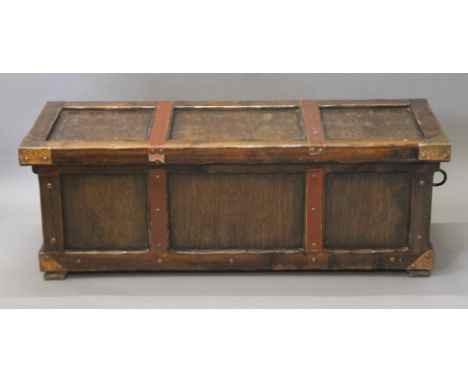 A metal and leather bound trunk. 132 cm long.