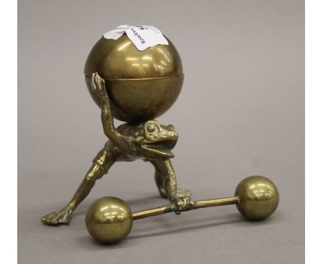 A brass frog form inkwell. 10 cm high.