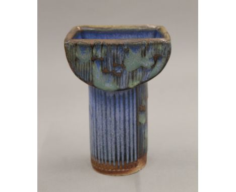 A Studio pottery candlestick. 15 cm high.