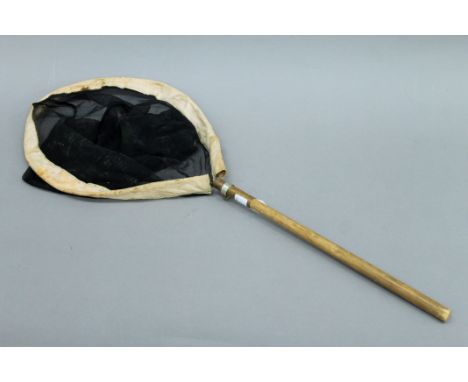 A vintage butterfly net. 70 cm long.