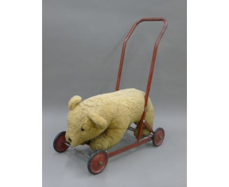 A Chiltern push-along teddy bear. 52 cm long.