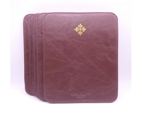 Six Patek Philippe placemats.   Each 24 x 20 cm.