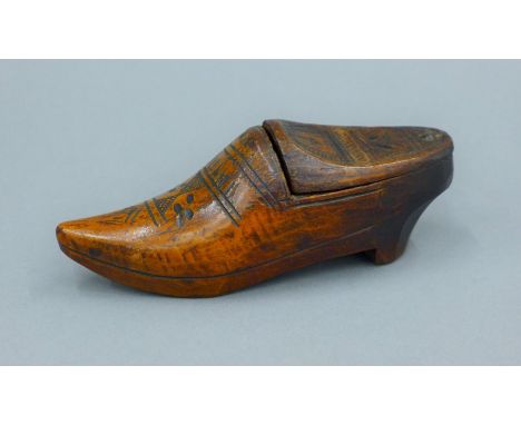 A 19th century Dutch clog form treen snuff box. 13 cm long.  