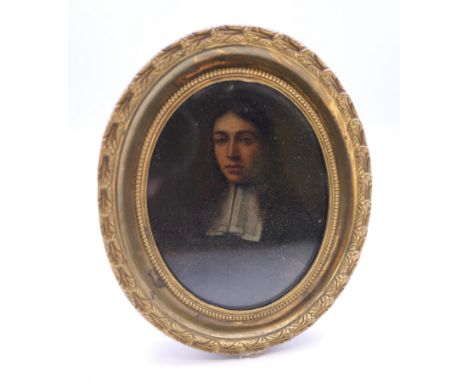 An 18th century portrait miniature of a Clergyman, housed in a pressed brass and wooden frame. 10.5 cm including frame.