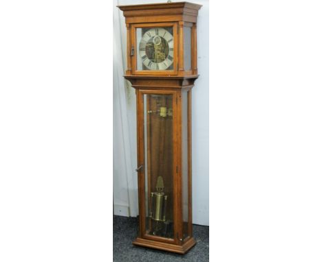 An oak cased electric master wall clock. 41.5 cm wide x 137 cm high.