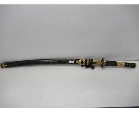 A modern Japanese Katana sword, edged blade approx 70cm with black and gold lacquered gilt metal mounted scabbard - 75cm, goo
