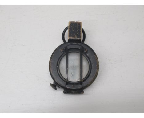 A WWII military type compass, working in saleroom 