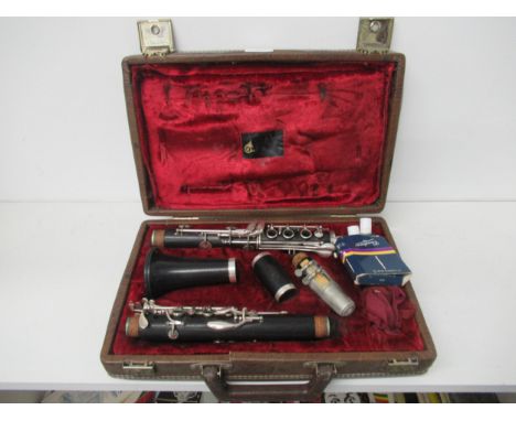 A clarinet in fitted leather case by Boosey &amp; Hawkes complete with accessories 