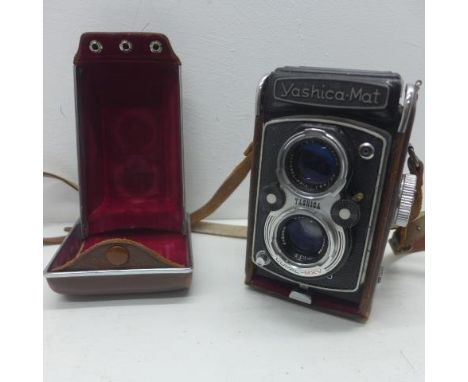 A Yashica-Mat twin lens camera in its leather case 