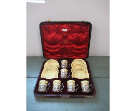 A late Victorian/Early Edwardian Royal Worcester '51' boxed set of six coffee cups and saucers with ornate silver cup holders