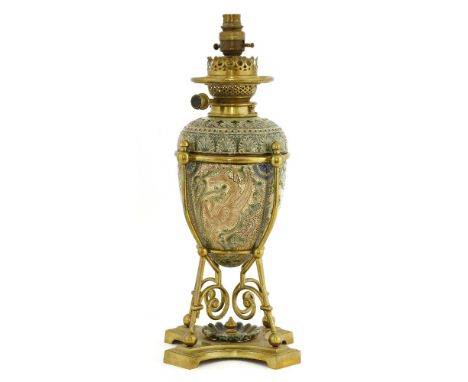 A Doulton Lambeth stoneware oil lamp, dated 1882, decorated by Mark V Marshall, incised with interlinking leaf scrolls and st