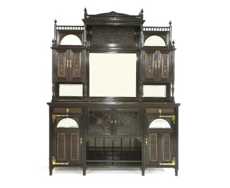 An Aesthetic ebonised burr wood sideboard,the central mirror bank flanked with a cupboard, over an arrangement of drawers and