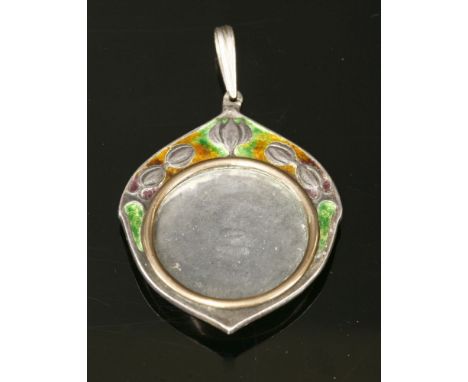 A silver and enamelled picture locket pendant by William Hair Haseler, design attributed to Archibald Knox, the locket of a t