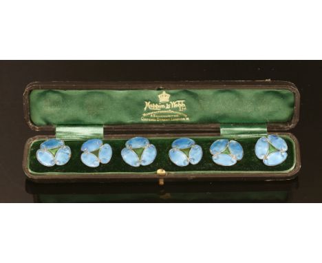 A cased set of six Art Nouveau silver enamel buttons, each button in the form of a stylised flower with a green enamel triang