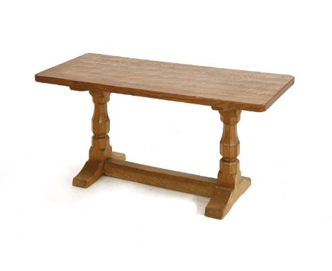 A Robert 'Mouseman' Thompson oak coffee table, the adzed top raised on octagonal baluster supports, with mouse signature,92cm