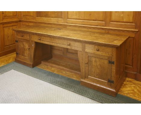 A Robert ‘Mouseman’ Thompson oak sideboard, the adzed top with scrolled corners, over three drawers, a cupboard to each side,