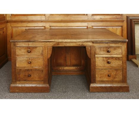 A Robert 'Mouseman' Thompson oak partners' desk, the adzed tops with scrolled corners, with a slide and three drawers either 