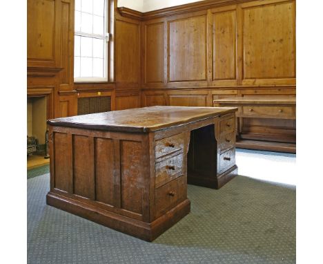 A Robert 'Mouseman' Thompson oak partners' desk, with an adzed top with scrolled corners, with three drawers either side of a