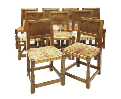 Nine Robert 'Mouseman' Thompson oak chairs, each with bur oak back panels, latticed leather seats and with plain stretchers, 