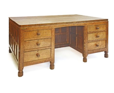 A Robert 'Mouseman' Thompson oak partners' desk,  with an adzed top and canted corners, with drawers either side a kneehole w