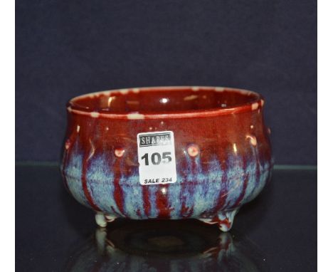 A Chinese ceramic censor, with blue and red mottled glaze and spot relief decoration, with Chinese relief pressed stamp to ba