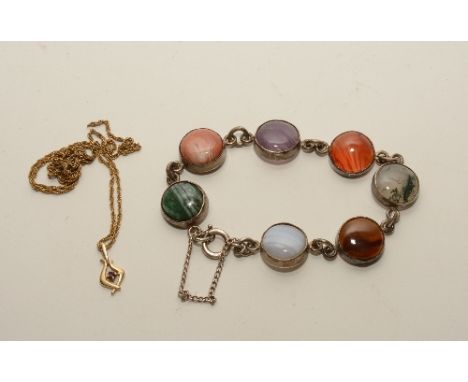 A 9ct gold and ruby pendant on chain, stamped 375, 3g, together with a silver and agate bracelet (2)