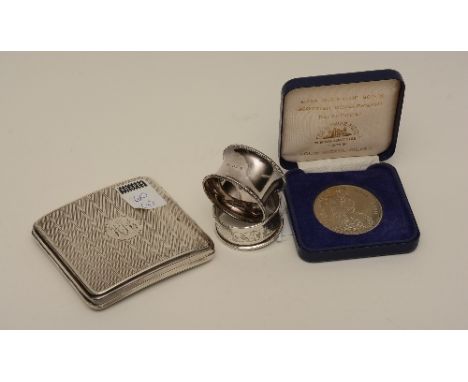 A silver cigarette case, hallmarks for Birmingham 1923-24, with engine turned decoration, engraved to interior and with monog